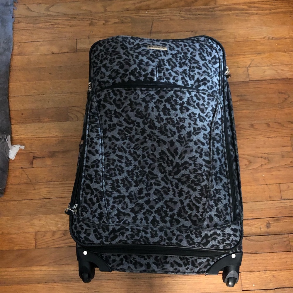 grey and black leopard print suitcase
